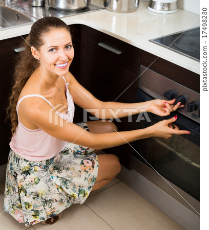 Cheerful girl making italian pizza 17498280