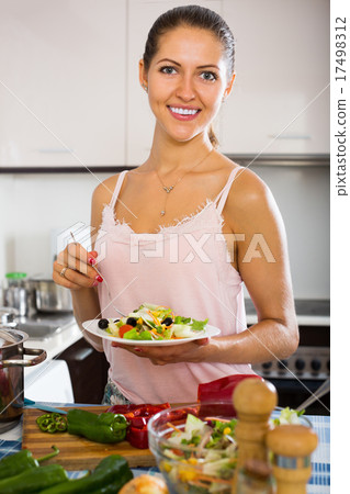 Housewife preparing salad with vegetables 17498312