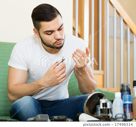 man using nail file 17498314