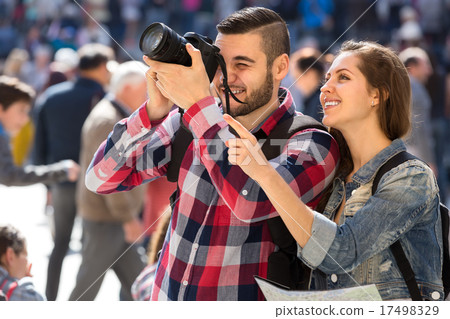 Tourists with camera and map Tourists with camera and map 17498329
