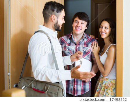 realtor showing new apartment to couple 17498332
