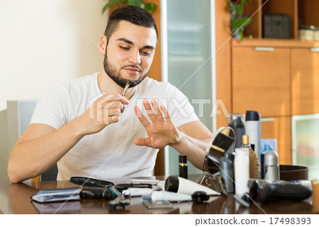 man using nail file 17498393