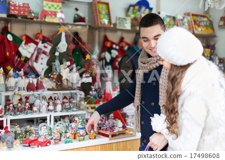 Couple choosing Christmas decoration 17498608