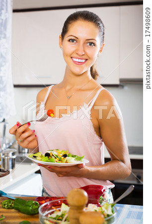 Woman enjoying vegetable salad 17498609