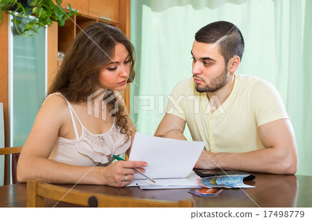 Young couple calculating budget 17498779