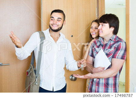 Realtor showing new apartment to couple Realtor showing new apartment to couple 17498787
