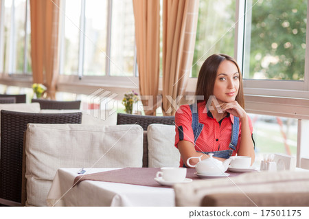 Attractive hipster woman is resting in cafeteria Attractive hipster woman is resting in cafeteria 17501175