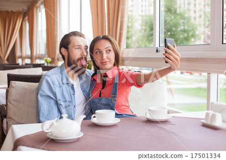 Attractive married couple is photographing Attractive married couple is photographing 17501334