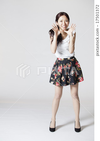 Female finger pointing pose 17501372