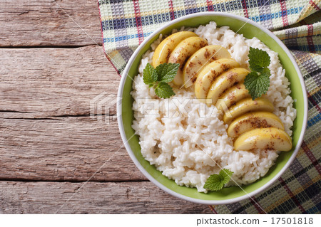 Rice with caramelized apples in a bowl. Horizontal 17501818