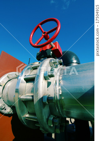 IndustrialSteel pipelines valves against blue sky 17504915