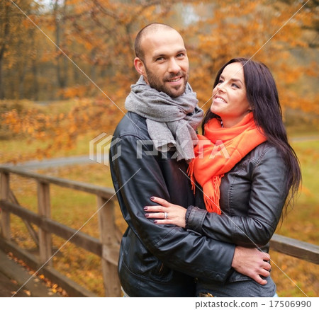 Happy middle-aged couple outdoors on beautiful autumn day Happy middle-aged couple outdoors on beautiful autumn day 17506990