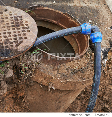 Cleaning equipment in a sewer manhole Cleaning equipment in a sewer manhole 17508139