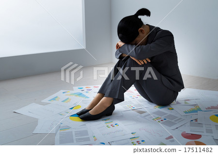 Female exhaustion depletion black company tired and depressed a lot of materials engineer OL office lady holding a knee 17511482