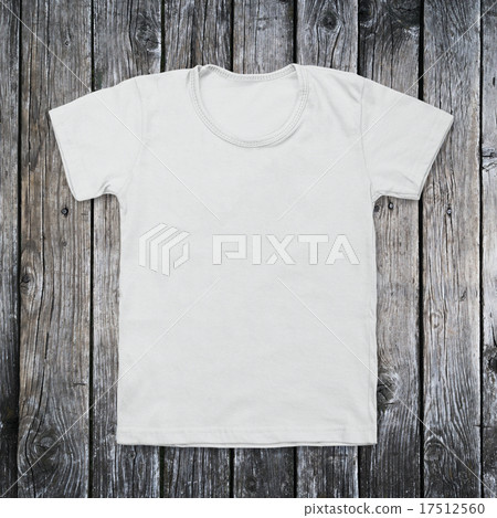 White blank t-shirt on dark wood desk White blank t-shirt on dark wood desk 17512560