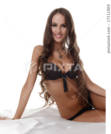 Shot of beautiful tanned woman posing in lingerie 17512869