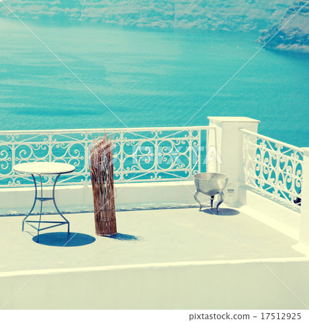 white terrace overlooking sea in Oia, Santorini white terrace overlooking sea in Oia, Santorini 17512925