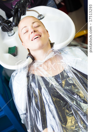 Hairdresser salon. Woman during hair wash.  17513293