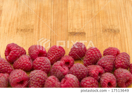 Ripe sweet raspberries on wood table close-up Ripe sweet raspberries on wood table close-up 17513649