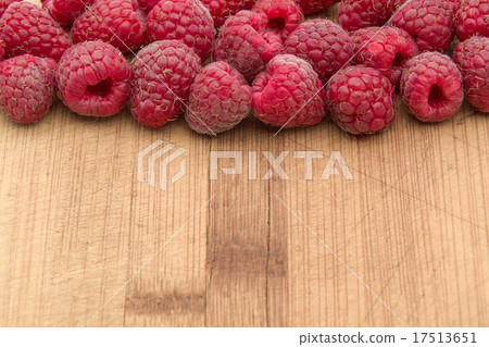 Ripe sweet raspberries on wood table close-up Ripe sweet raspberries on wood table close-up 17513651