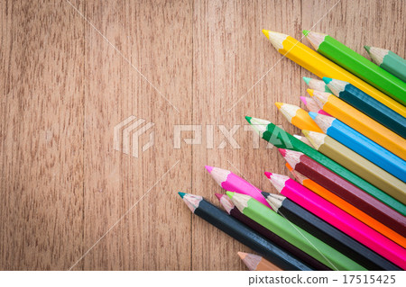 Stack colour pencils on wooden background Stack colour pencils on wooden background 17515425