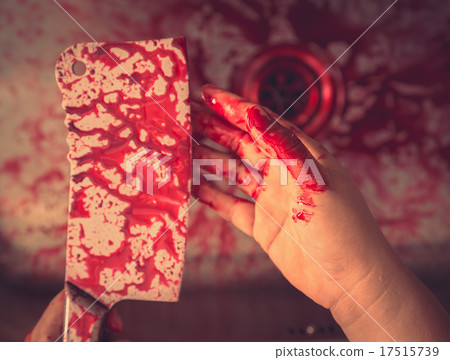 Hand hold bloody knife in a steel shell for halloween ( Filtered 17515739