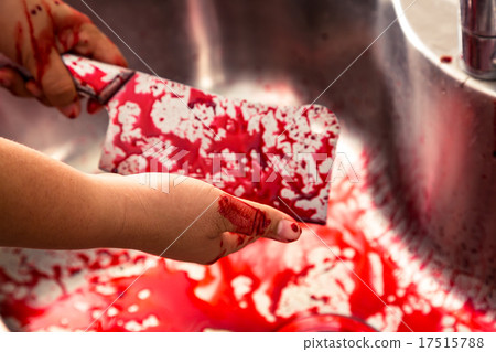 Hand hold bloody knife in a steel shell for halloween 17515788