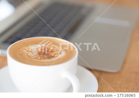 laptop with coffee cup on old wooden table ( Filtered image proc laptop with coffee cup on old wooden table ( Filtered image proc 17516065