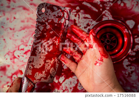 Hand hold bloody knife in a steel shell for halloween 17516088