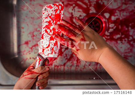 Hand hold bloody knife in a steel shell for halloween 17516148