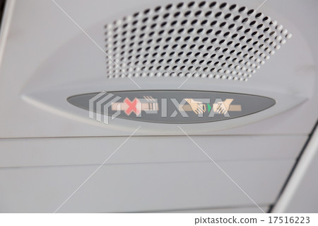 No smoking sign and seat belt sign on the airplane No smoking sign and seat belt sign on the airplane 17516223