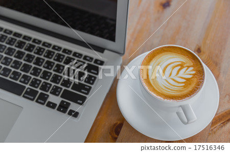 laptop with coffee cup on old wooden table 17516346