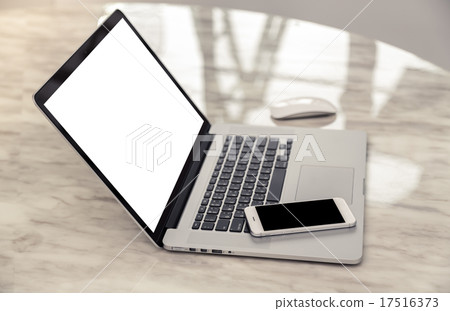 laptop with smart phone on table laptop with smart phone on table 17516373