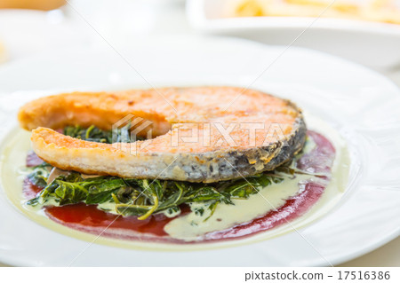 Grilled Salmon Steak with Spinach 17516386