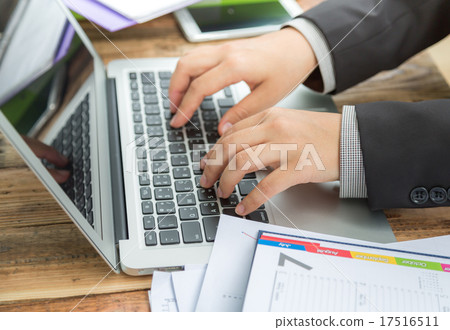 Closeup of business woman hand typing on laptop keyboard Closeup of business woman hand typing on laptop keyboard 17516511