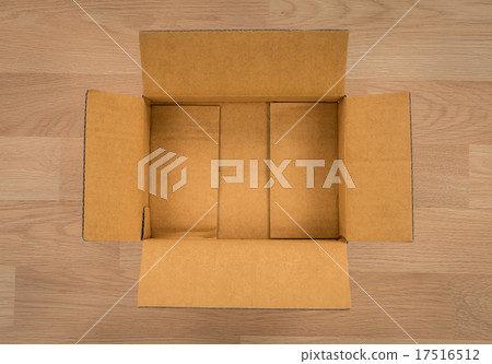Cardboard box on wood 17516512