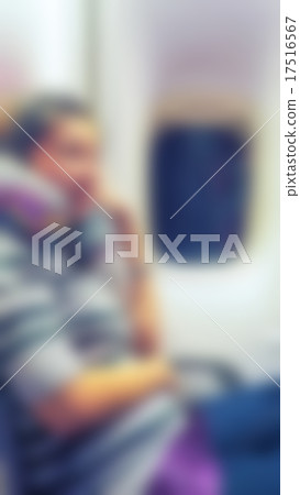 Abstract blur woman in the interior of the airplane 17516567