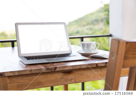 laptop with coffee cup on old wooden table 17516569
