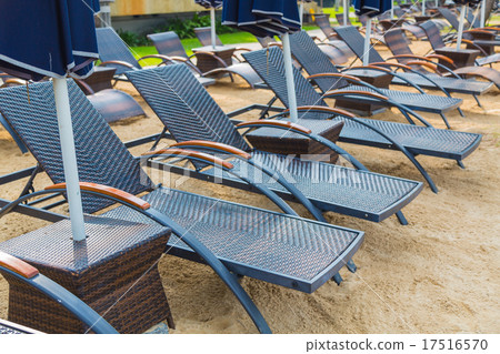 Beach chairs and umbrella on sand beach Beach chairs and umbrella on sand beach 17516570