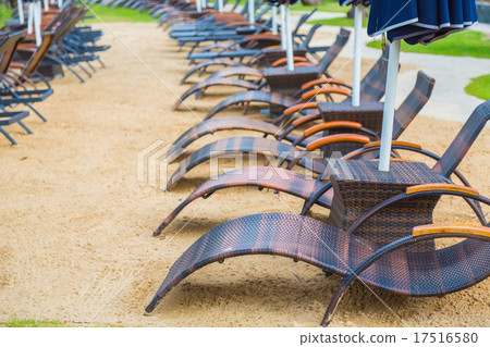 Beach chairs and umbrella on sand beach Beach chairs and umbrella on sand beach 17516580
