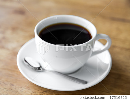 Coffee in white cup on wood table Coffee in white cup on wood table 17516823