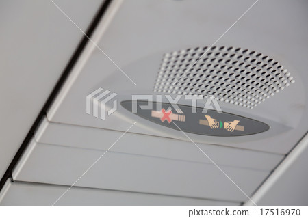 No smoking sign and seat belt sign on the airplane 17516970