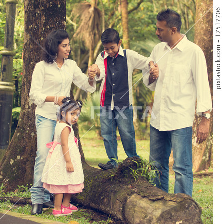 indian family teaching children to climb 17517706