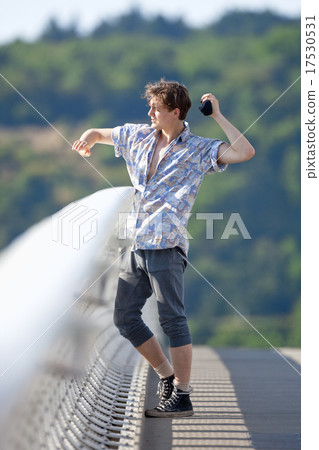Young Man Standing on the Bridge Young Man Standing on the Bridge 17530531