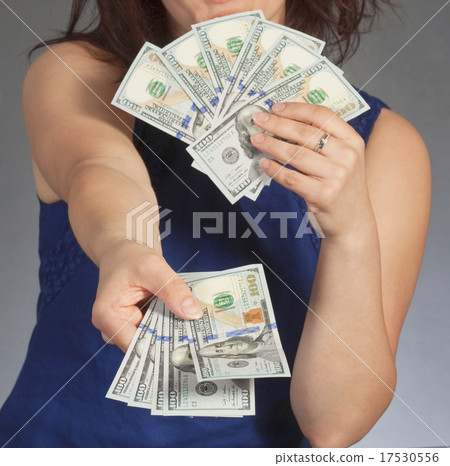 Woman Holding New 100 US Dollar Bills 17530556