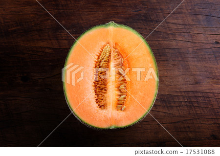 Organic cantaloupe on wooden table 17531088