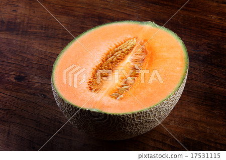 Organic cantaloupe on wooden table 17531115