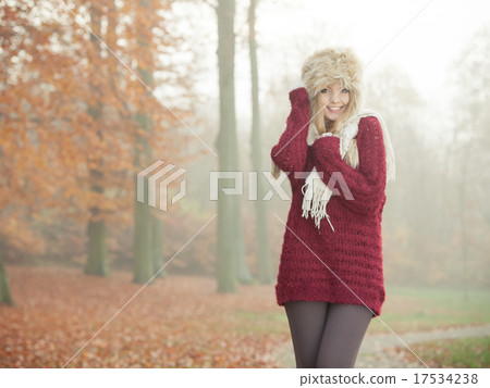 Portrait of pretty smiling woman in fur winter hat 17534238