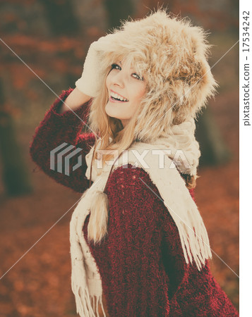 Portrait of pretty smiling woman in fur winter hat 17534242