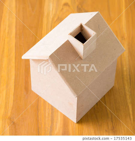 small wood house model on brown wooden background small wood house model on brown wooden background 17535143